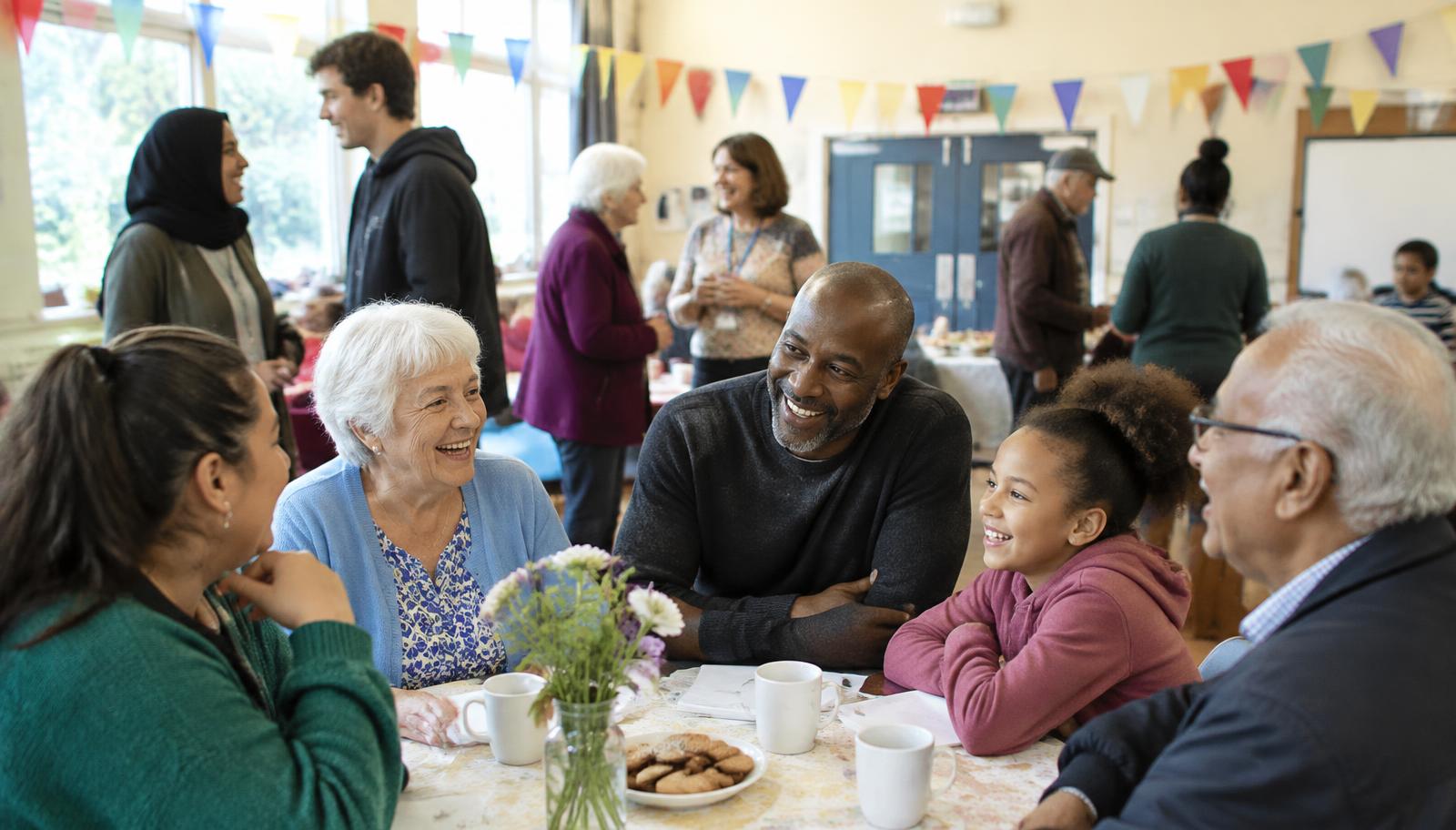 Neighbours of all ages enjoying time together at a community centre